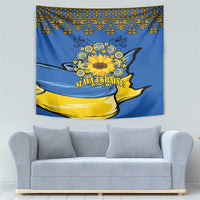 Blue wall tapestry with yellow sunflower wreath and decorative folk border above sofa