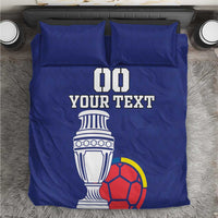 Blue football bedding set with duvet and two pillowcases, 'DO YOUR TEXT' trophy and soccer ball