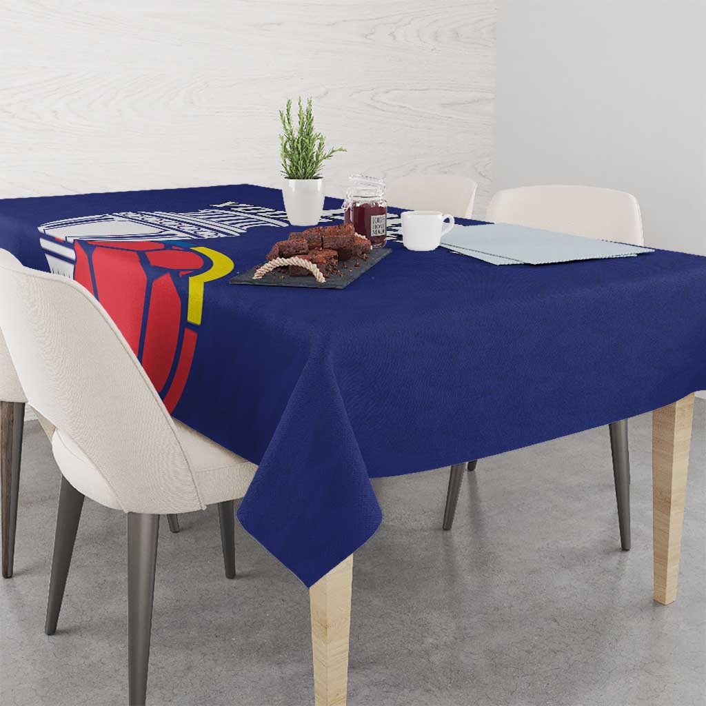 Blue football tablecloth on dining table with chairs and cup-and-ball graphics