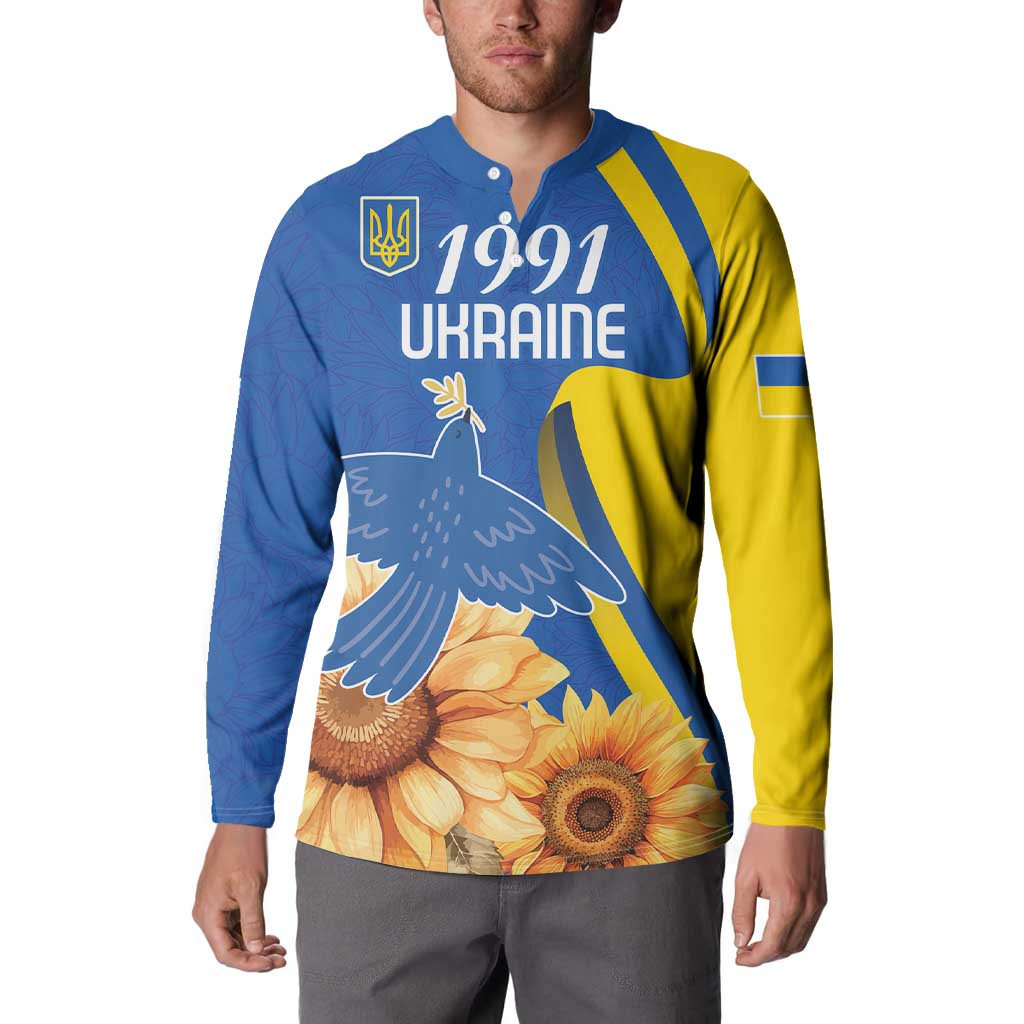 Blue and yellow button-up sweatshirt on model, front “1991 Ukraine” dove and sunflower
