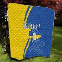 Blue and yellow quilt with diagonal stripes, peace dove, and “YOUR TEXT” print