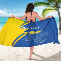 Personalized blue and yellow sarong draped, showing “YOUR TEXT” and trident dove emblem