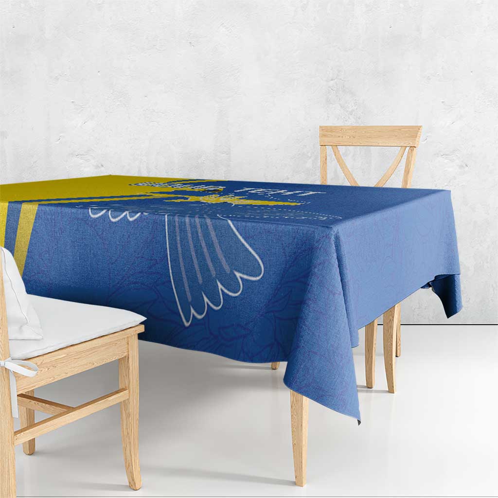 Blue tablecloth with peace dove wing outline, draped over dining table