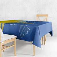 Blue tablecloth with peace dove wing outline, draped over dining table