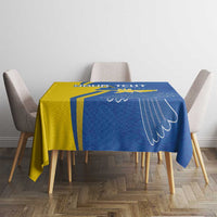 Blue and yellow tablecloth with peace dove wing print on dining table