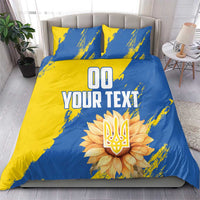 Blue and yellow duvet cover set with two pillows, 'YOUR TEXT' and sunflower emblem