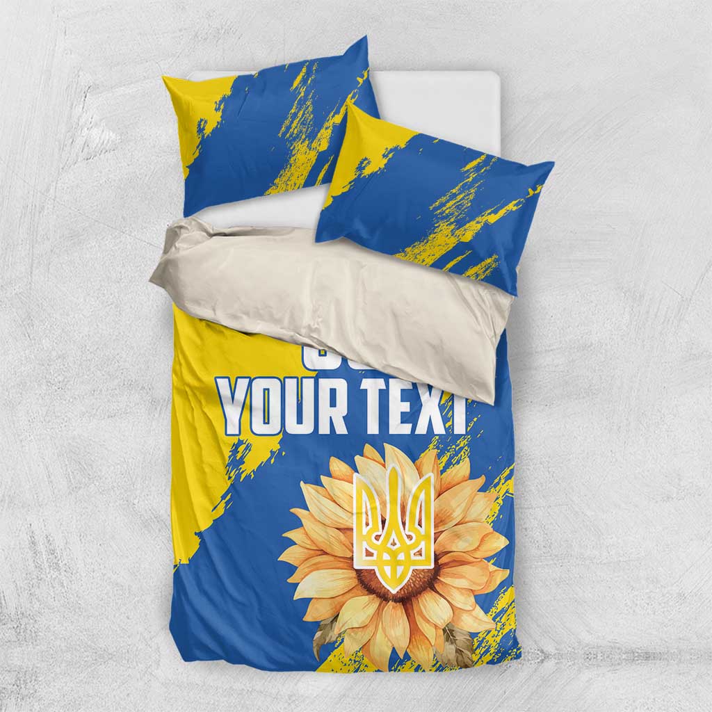 Blue and yellow bedding set with duvet cover and two pillows, 'YOUR TEXT' and sunflower emblem