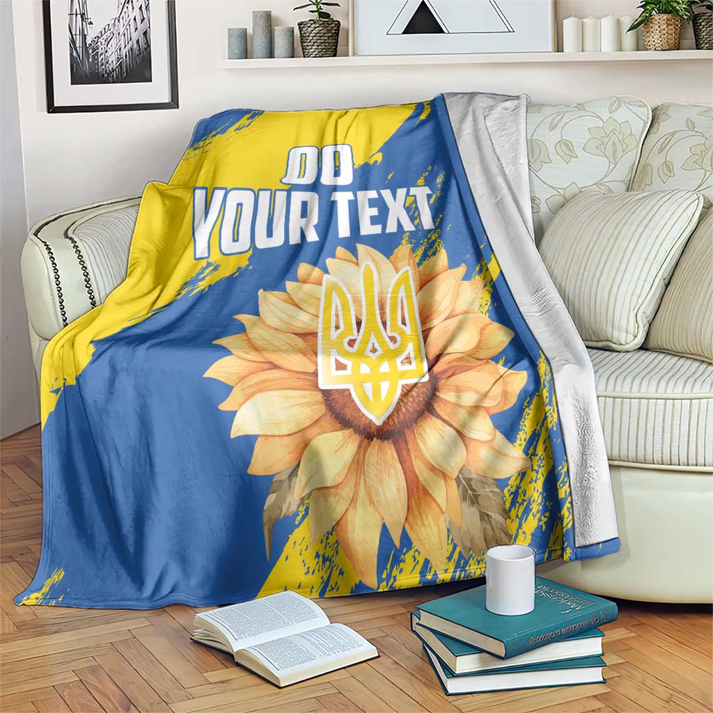 Blue/yellow blanket with flower emblem and 'YOUR TEXT' print