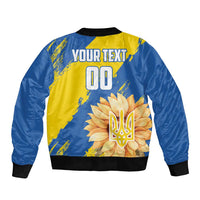 Unisex blue and yellow bomber jacket back view with sun and trident graphic