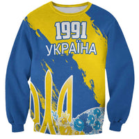 Blue and yellow sweatshirt with 1991 UKRAINA print and dove motifs