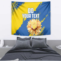 Blue and yellow hanging tapestry with flower emblem and bold custom text
