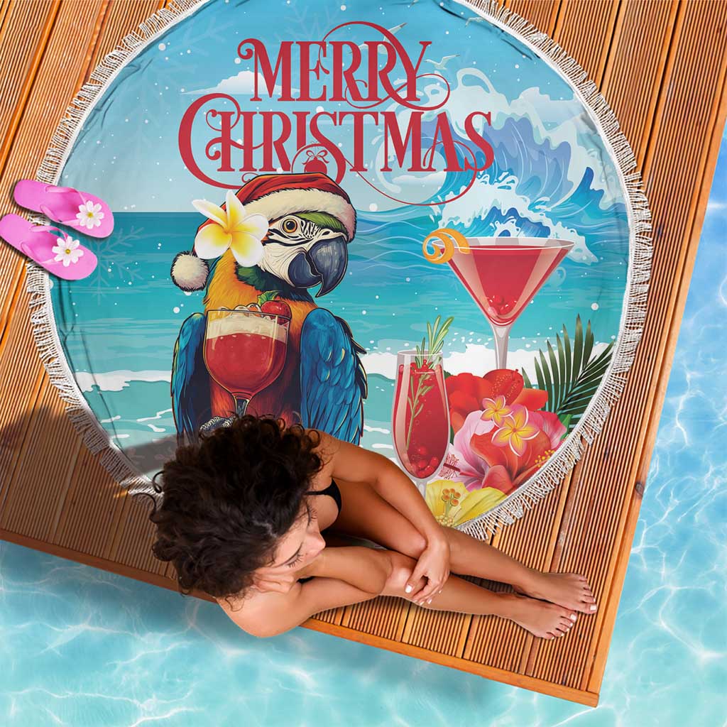 Round blue beach blanket with fringe, parrot beside cocktail glass and 'Merry Christmas'