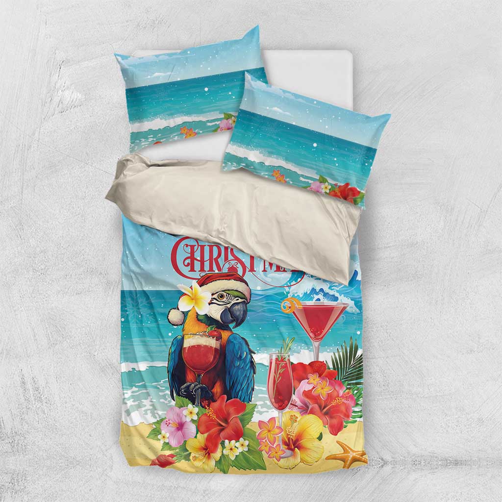 Christmas bedding set flat lay: teal waves, parrot holding red cocktail, floral 'Merry Christmas'
