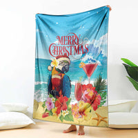 Blue tropical Christmas blanket draped with parrot, martini drinks, and starfish