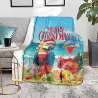 Blue tropical Christmas blanket on gray rug, parrot and flowers with cocktail glasses