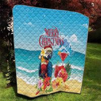 Blue quilted Christmas quilt with tropical parrot holding a rum punch cocktail and “Merry Christmas”