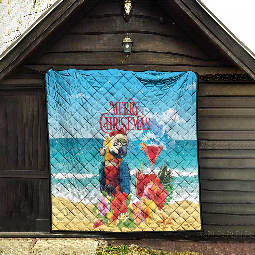 Blue Christmas quilt hanging on wall with tropical parrot, rum punch cocktail, and “Merry Christmas”