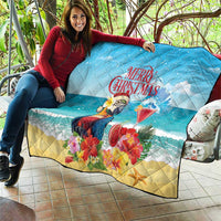 Blue Christmas quilt on couch-style seating with tropical parrot and rum punch cocktail