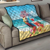Blue Christmas quilt draped over a sofa, showing tropical parrot and rum punch cocktail