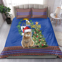 Blue Christmas bedding set featuring a seated cat with Santa hat, tree and folk patterned edges
