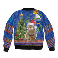 Unisex blue bomber jacket with rear graphic cat in Santa hat, Christmas tree and stripes