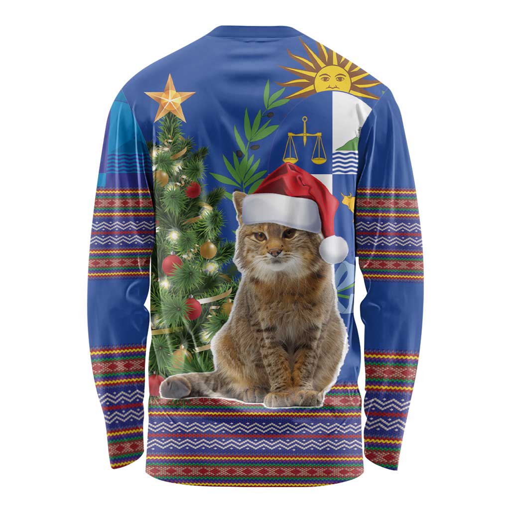 Blue long-sleeve Christmas shirt with seated cat wearing Santa hat, tree and folk trim