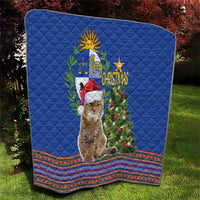 Blue Christmas quilt with pampas cat wearing a Santa hat and decorated tree, folk hem border.