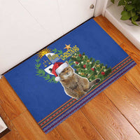 Blue Christmas cat rubber doormat with Santa hat, tree graphic, and striped folk edge