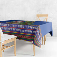 Blue Christmas tablecloth with colorful zigzag and geometric folk pattern on table