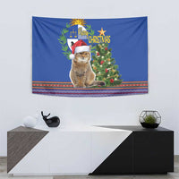 Blue wall hanging Christmas tapestry with cat in Santa hat and decorated tree