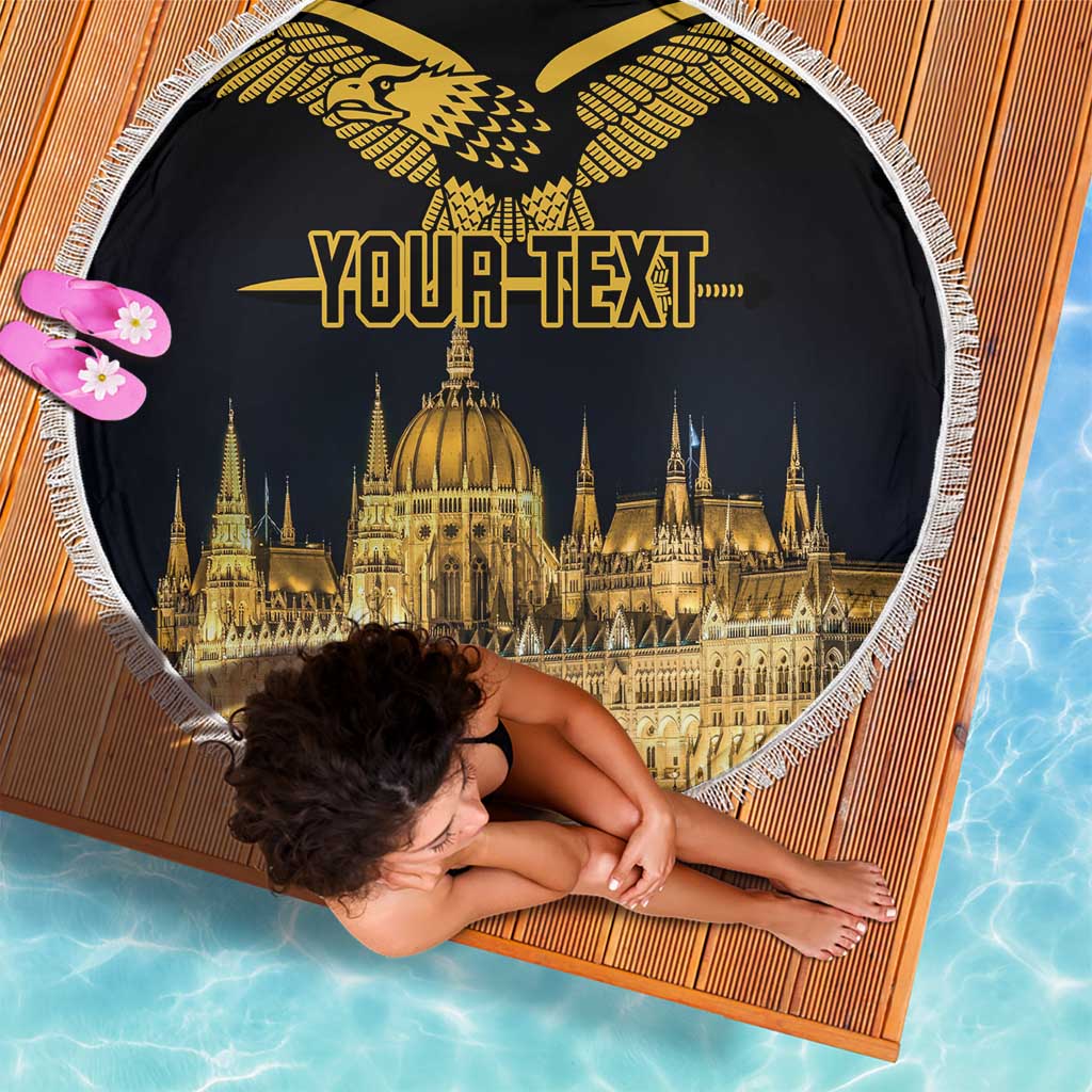 Round black beach blanket with white fringe; gold Turul bird and Budapest skyline, "Your Text"