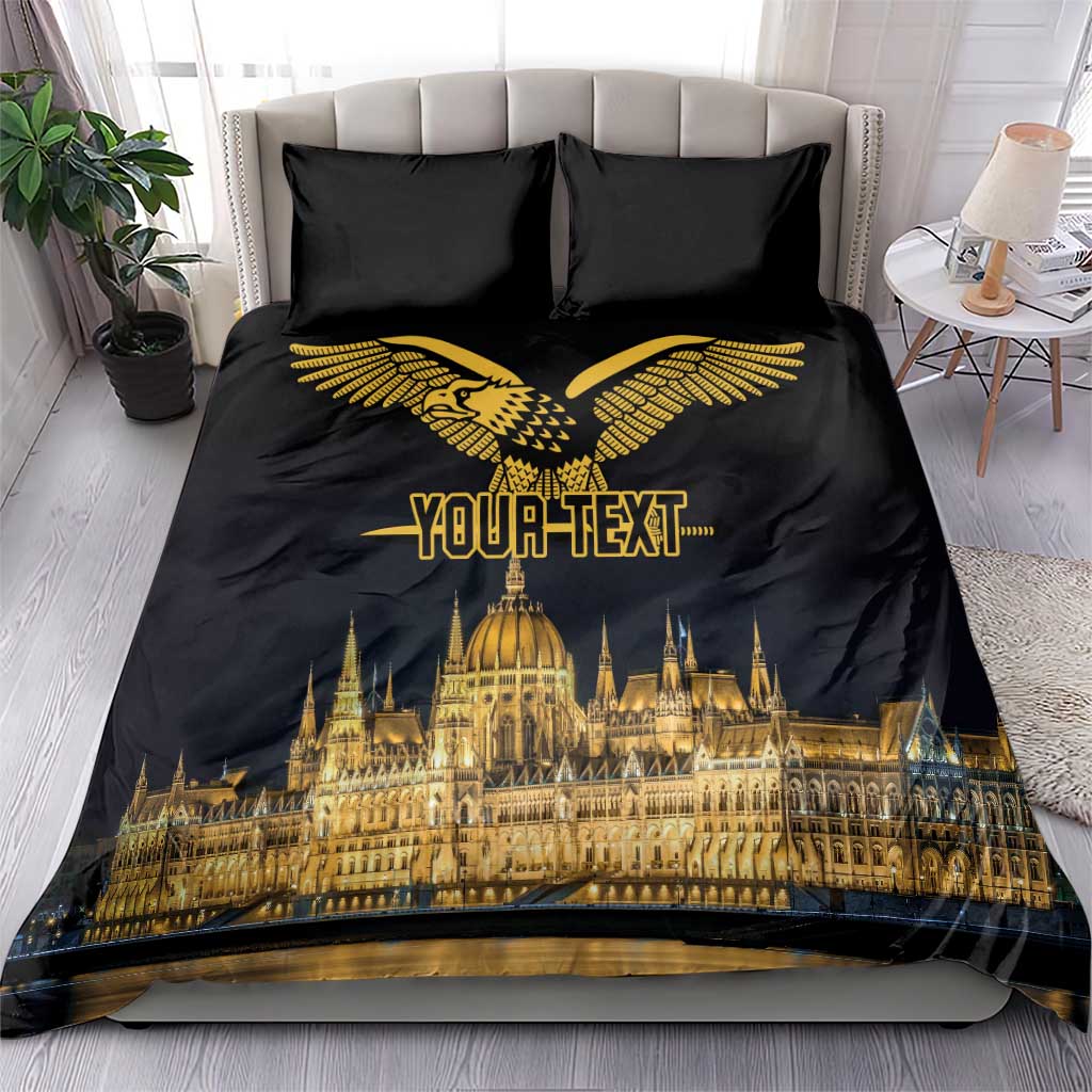 Black duvet cover with gold bird emblem and skyline print, paired with two black pillowcases