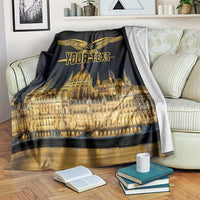 Black blanket with gold bird emblem and Budapest skyline graphic