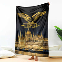 Black draped blanket with gold bird emblem and Budapest skyline print