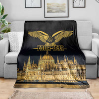 Black blanket with gold bird emblem, Budapest skyline, and centered text