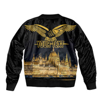 Black bomber jacket with gold winged bird on back, skyline and 'YOUR TEXT' design