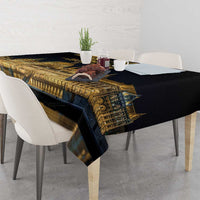 Black tablecloth draped over table edge, featuring golden Budapest skyline and Turul bird art
