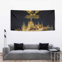 Black tapestry with gold turul bird above 'YOUR TEXT' and Budapest Parliament skyline