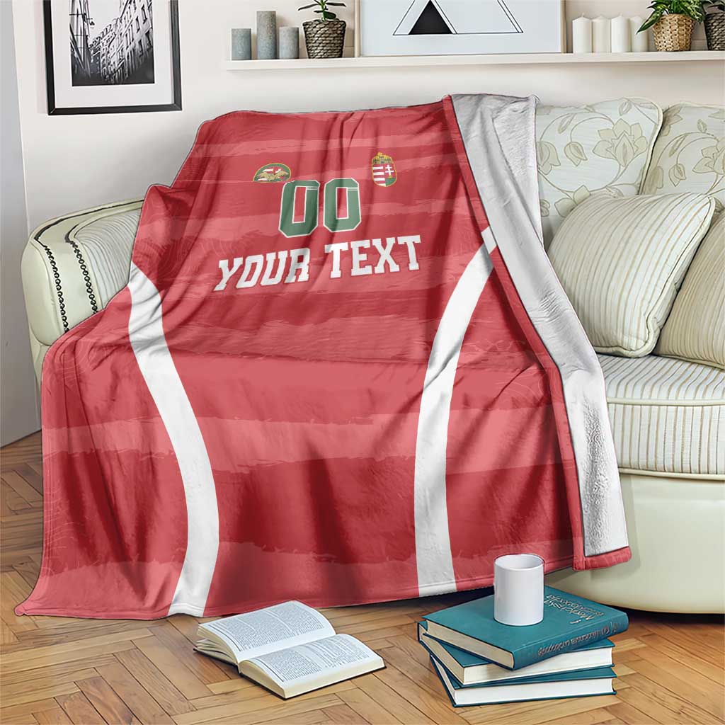 Red Hungary football blanket with white curved stripes, crest icons, and “YOUR TEXT”