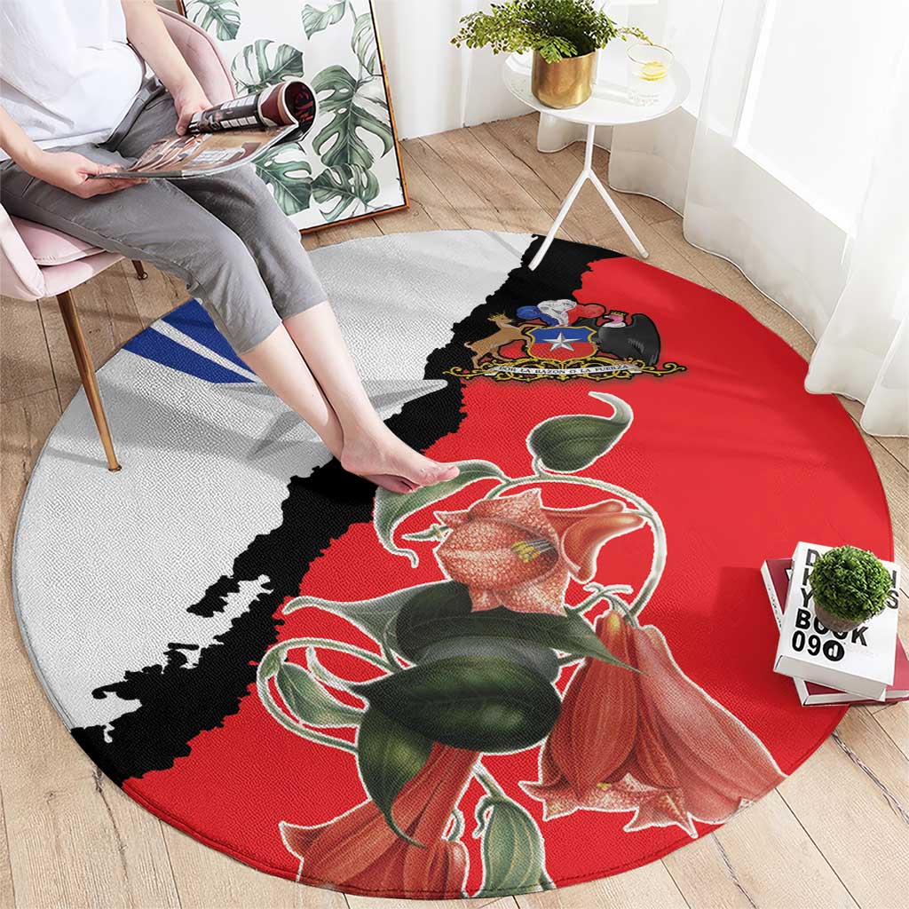 Round red area rug with gray and black graphic, star motif, and floral artwork
