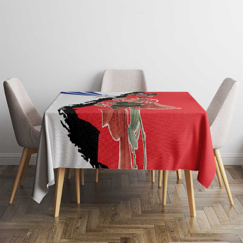 Red tablecloth with Chile-themed print over table, visible black and blue accents