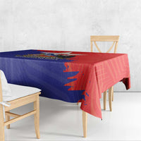 Red and blue Chile crest tablecloth draped over table edge