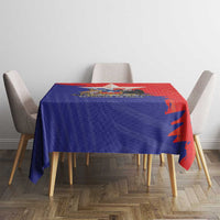 Red-and-blue Chile coat of arms tablecloth covering dining table