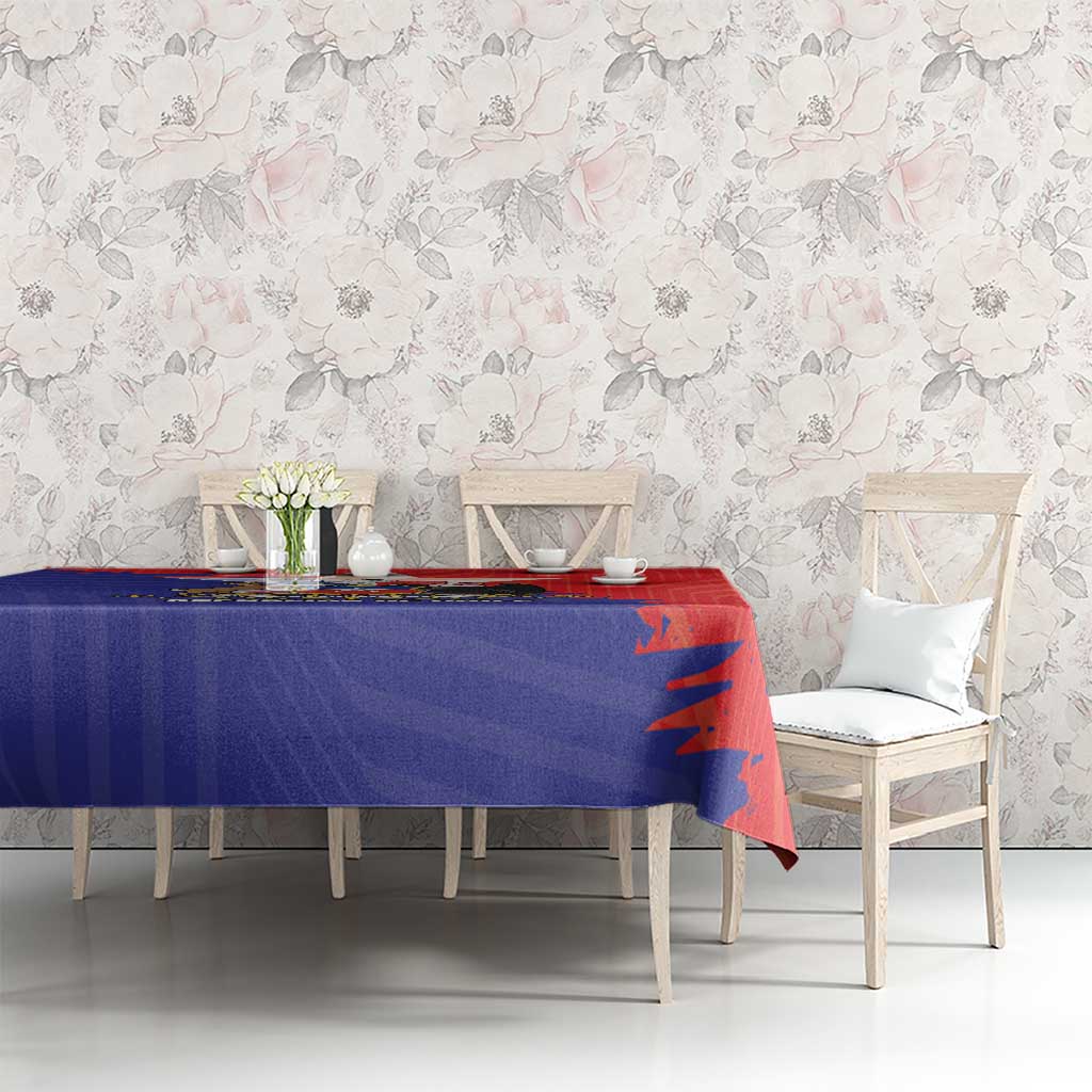 Red and blue Chile crest tablecloth on dining table with white chairs