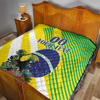 Bed quilt featuring yellow-green striped design, white diagonal stripe, blue “YOUR TEXT” and emblem