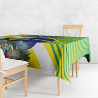 Colorful green, yellow, and blue tropical tablecloth with bold striped and leaf pattern