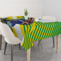 Rectangular tropical tablecloth in green, yellow, and blue with bird, leaves, and stripes