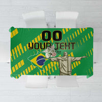 Green Brazil-themed tablecloth with yellow flag stripes and Cristo Redentor statue