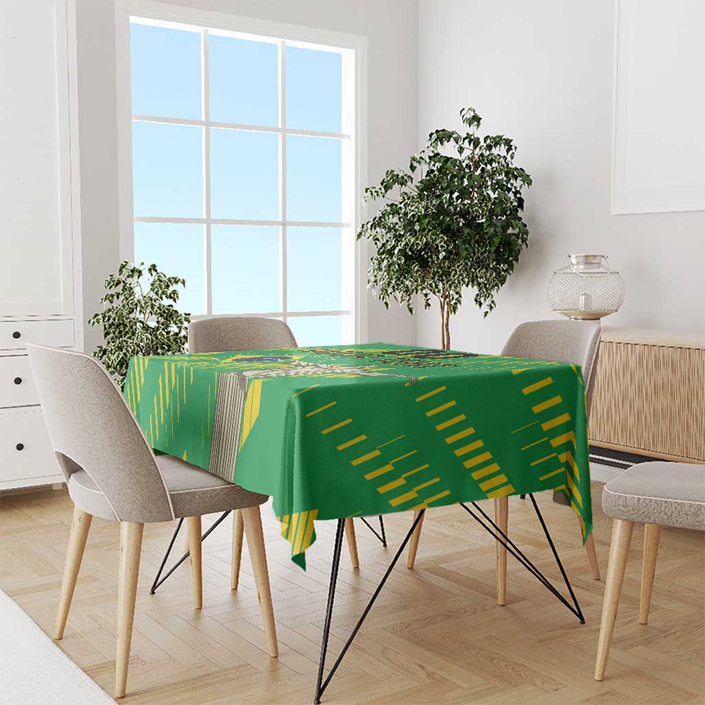 Green tablecloth with Brazil-style yellow stripe design, set on dining table