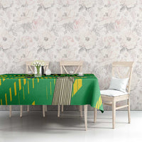 Green Cristo Redentor tablecloth with yellow stripe pattern on dining table